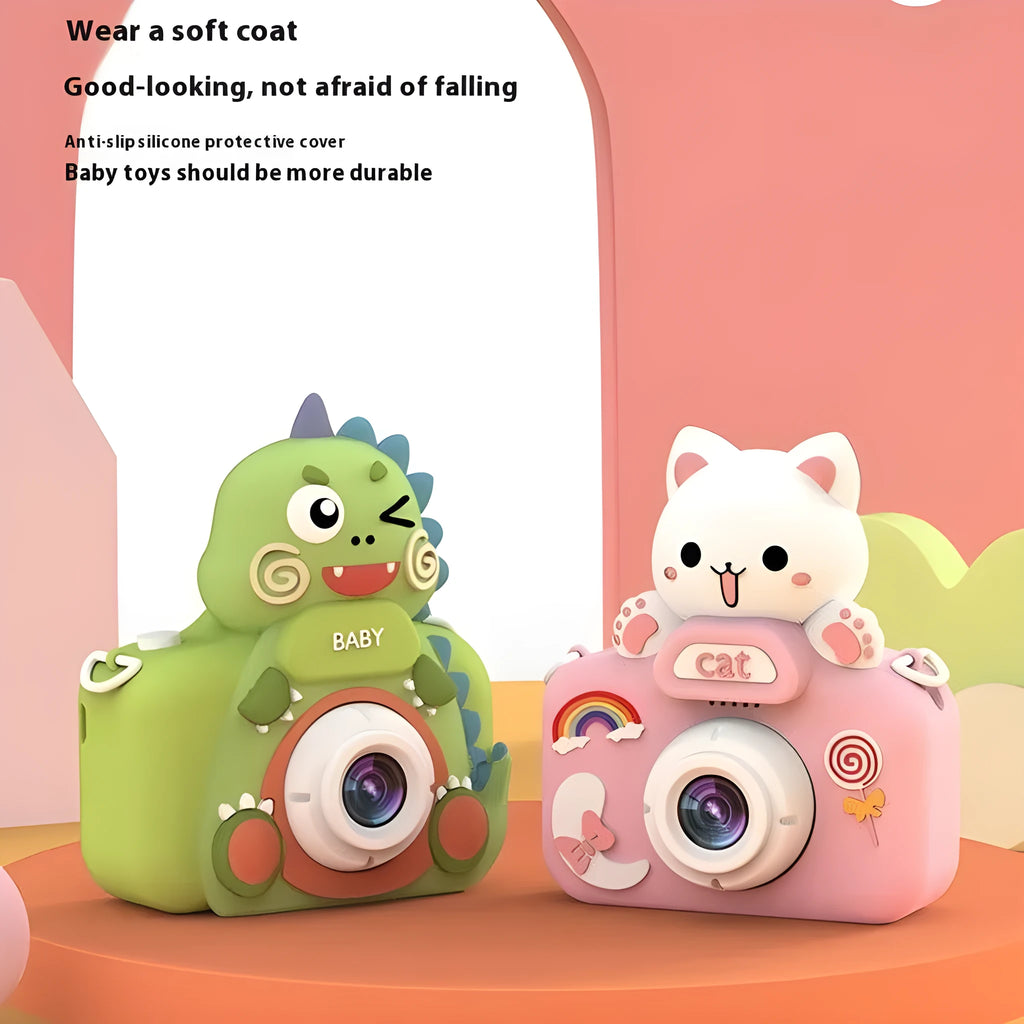 Children's mini cartoon camera with silicone body, Big Head Dinosaur colour, with lanyard and charging cable on white background