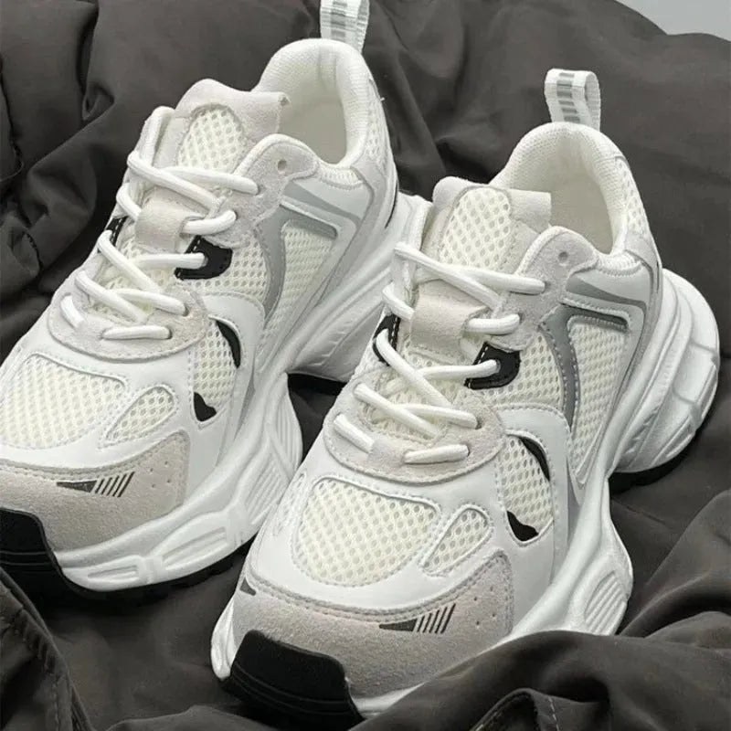 Beige mesh platform sports shoes with a wedge heel and front lace-up fastening on a rubber sole.