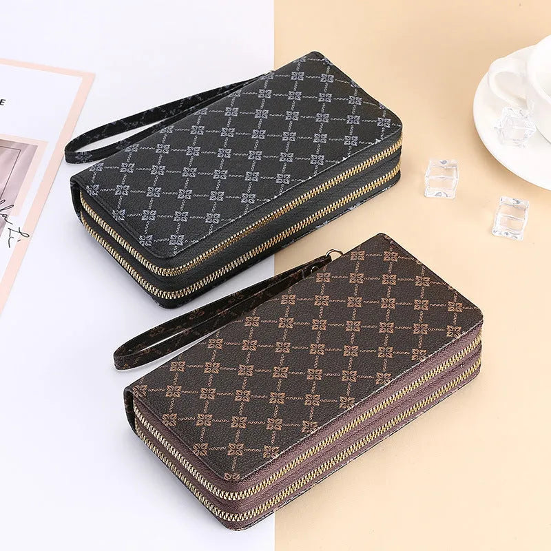 Long black PU leather wallet clutch with print detail showing mobile phone compartment and coin purse