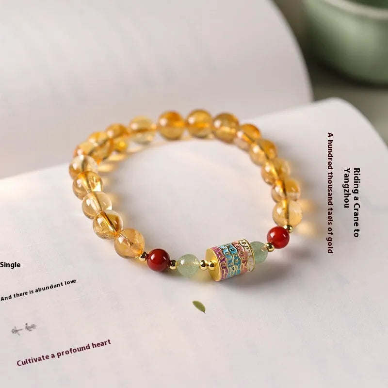 Women's citrine bracelet with 8mm prayer wheel design in yellow retro style