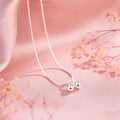 Silver cherry pendant necklace on an adjustable snake bone chain for women.