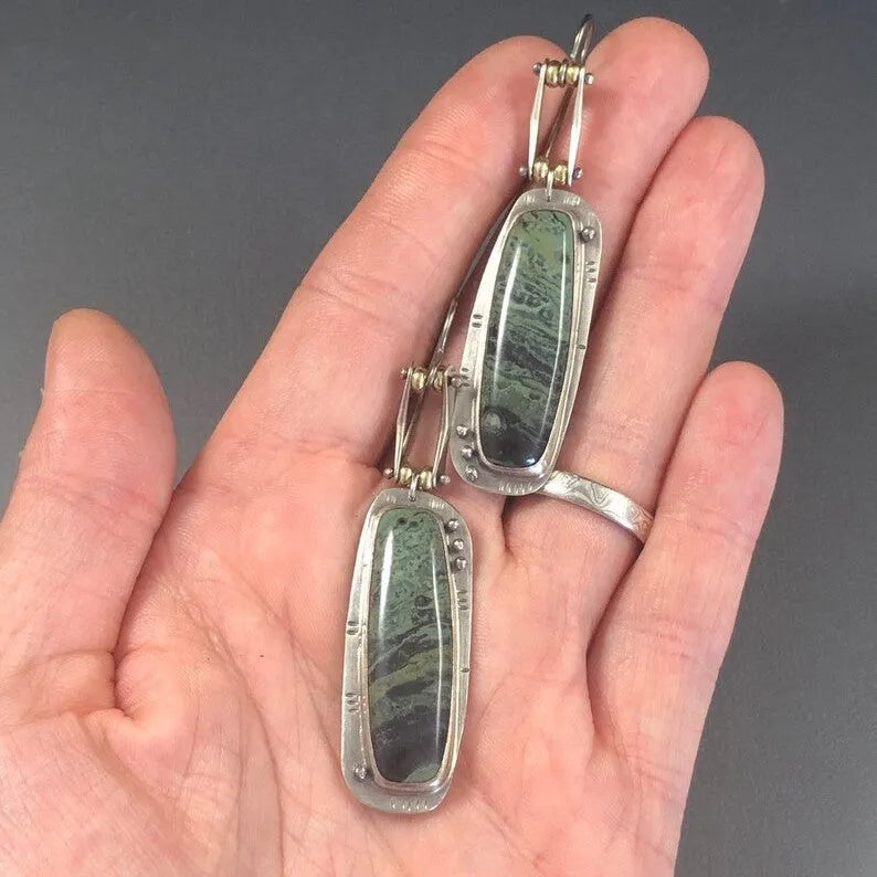Geometric-shaped alloy earrings with a white and grey two-tone marble pattern.