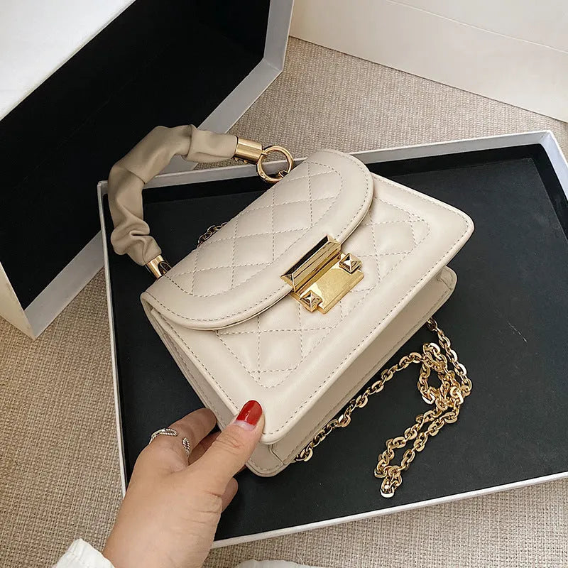 Women's purple rhombus square shoulder bag with crossbody strap showing structured design