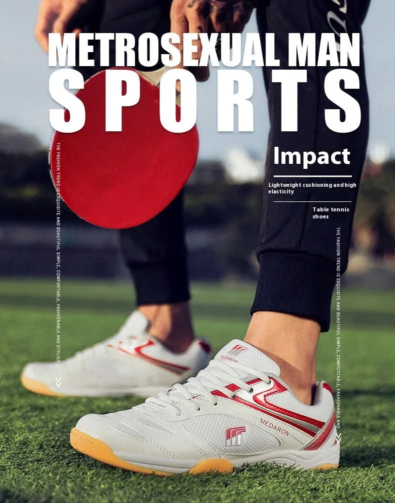 White and red mesh table tennis sneakers with rubber sole and lace-up front.