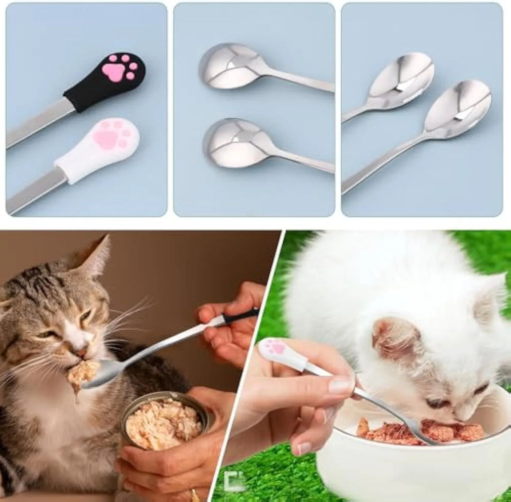 Two stainless steel pet food spoons with white and black silicone handles featuring a cat paw print design.