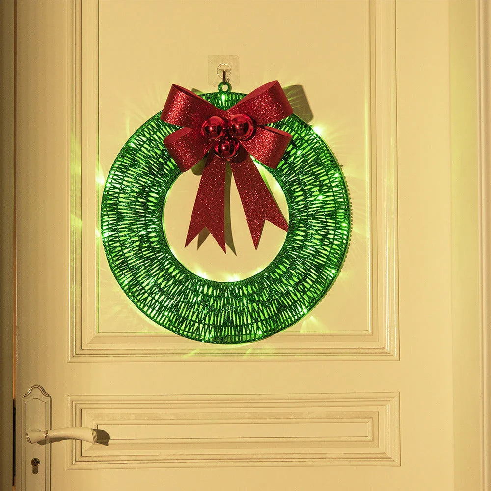 Festive 20-inch luminous LED Christmas wreath with gold and green tinsel garland and large bow