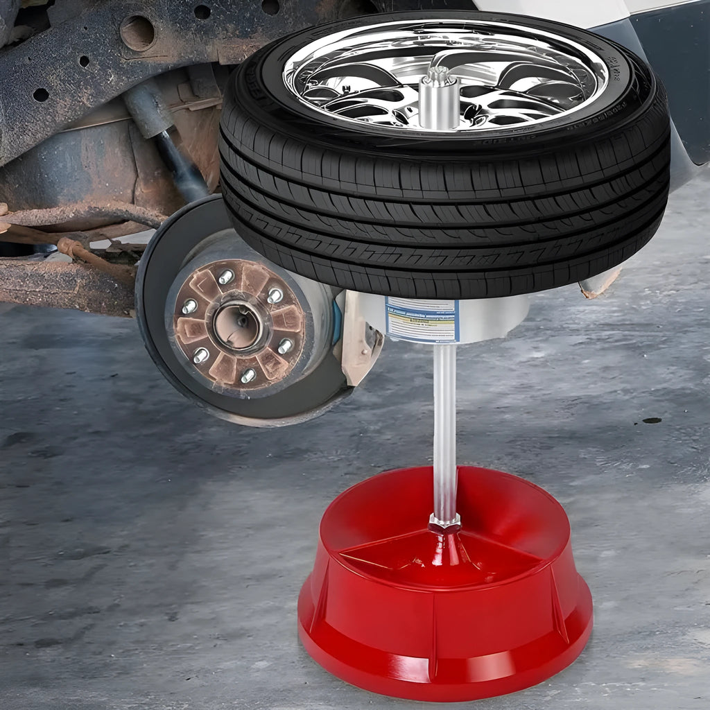 Portable aluminium hub wheel balancer with bull's eye level on enamel base.