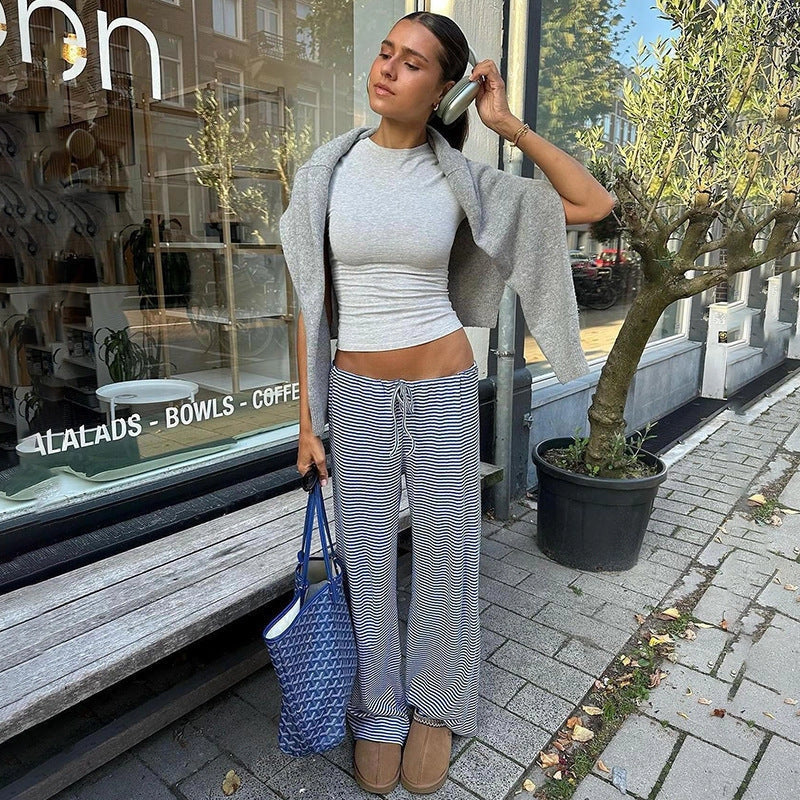 Women's striped print trousers with lace-up detail and wide-leg design in various colours