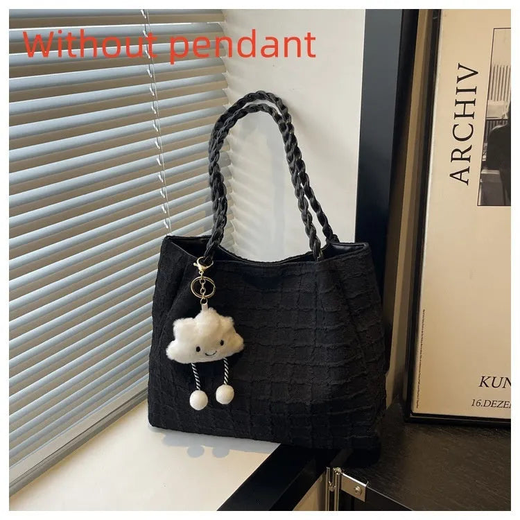 Women's canvas shoulder messenger bag large bucket shape with magnetic clasp and phone pocket, available in black, blue, pink, white.