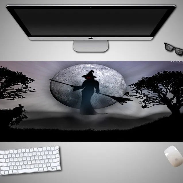 Oversized Halloween themed gaming mouse pad with non-slip rubber cloth base on a desk