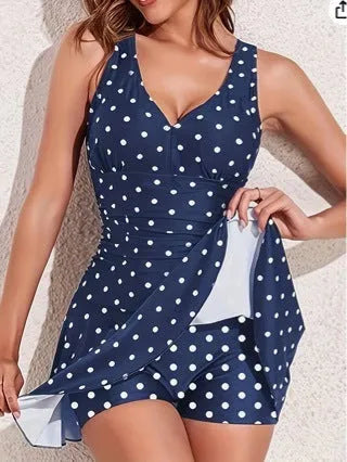 Blue polka dot print women's plus size bikini swimsuit on a hanger