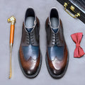 Men's curry blue leather brogue boots with decorative stitching and front lacing on a low square heel.