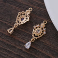 Copper water drop pendant with hollow crown design and zircon details in assorted colours.