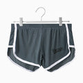 Men's solid colour Ice Silk quick-dry underwear in mid waist style on a grey background.