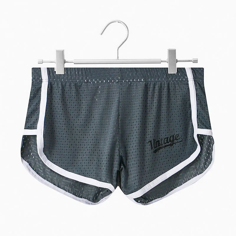 Men's solid colour Ice Silk quick-dry underwear in mid waist style on a grey background.