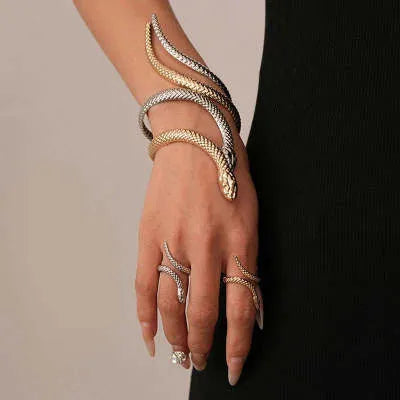 Gold twisted snake bracelet and ring jewellery set with exaggerated winding design