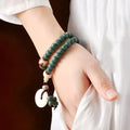 White jade Bodhi seed and green sandalwood Buddhist bracelet with double ring safety buckle and lotus charm