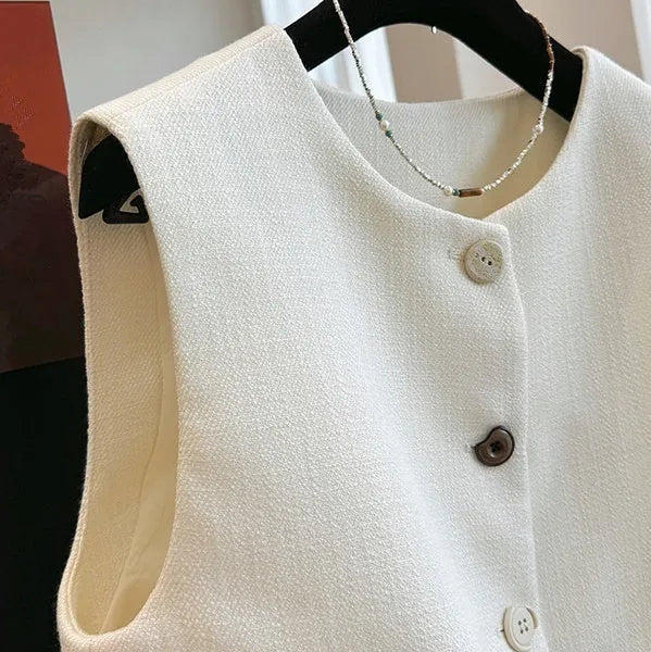 Women's French-style polyester bandage vest dress in milky white colour with round neck and sleeveless design