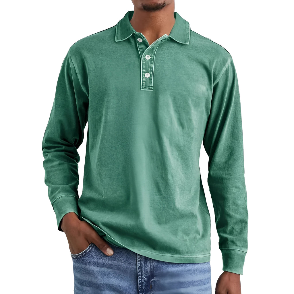Man wearing a retro washed grey cotton polo shirt with distressed details and a lapel collar.