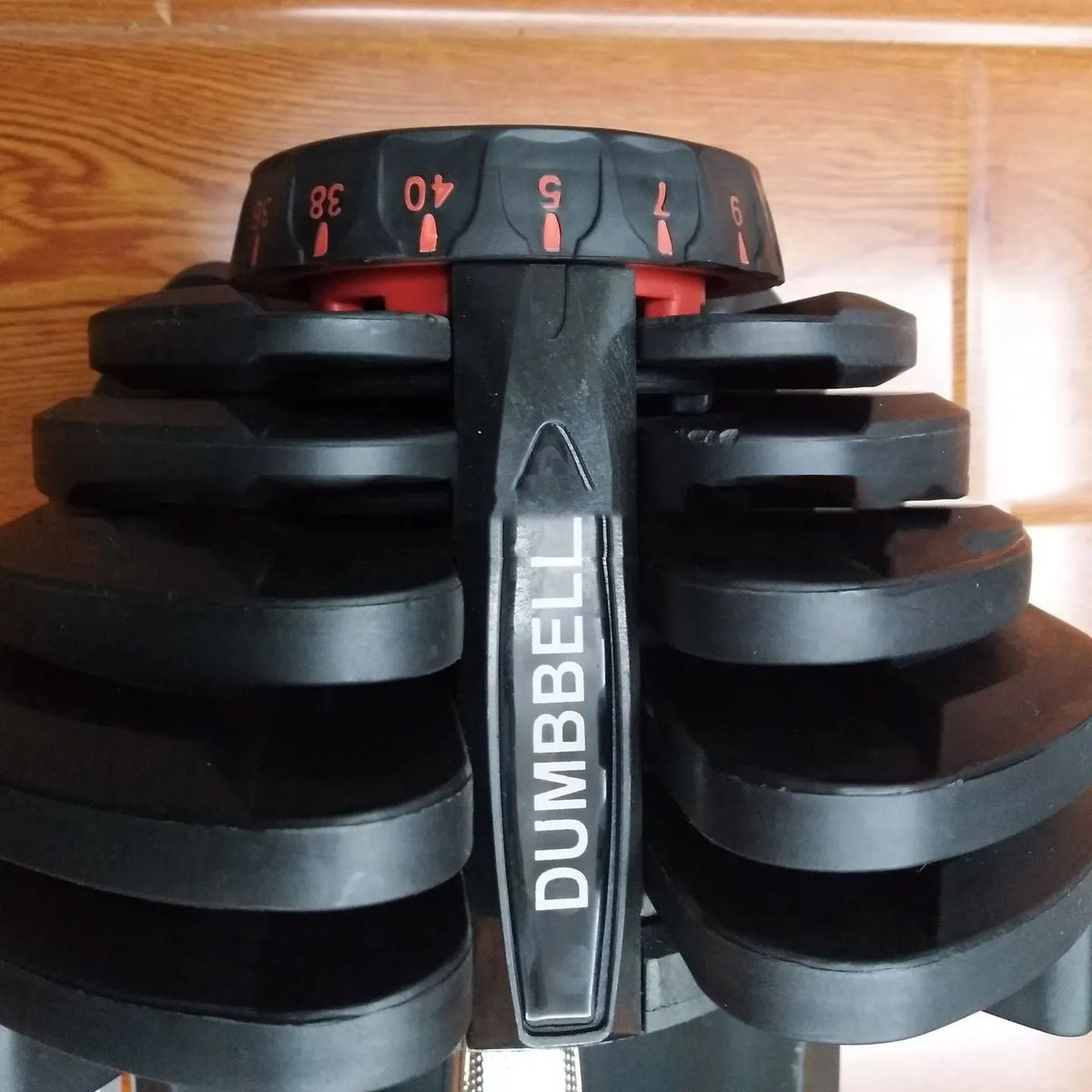 Men's automatic quick adjustment dumbbell in black with iron and plastic construction