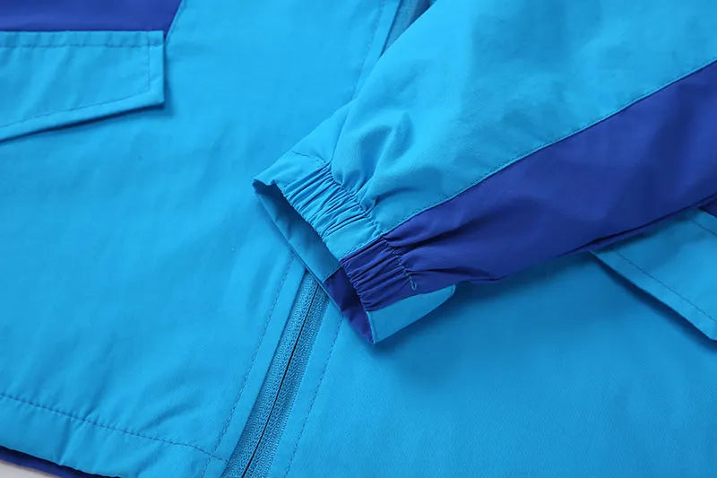 Boy wearing a blue zip-up sanded acetate jacket for autumn