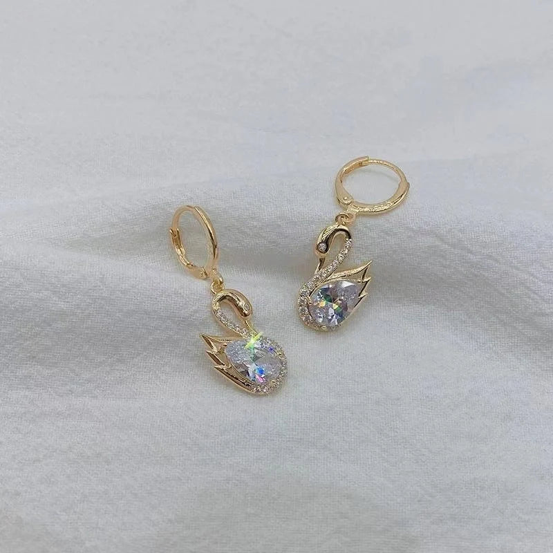 Sweet Rhinestone Swan Earrings in gold, green, and suit colours, showcasing unique design and sparkle.