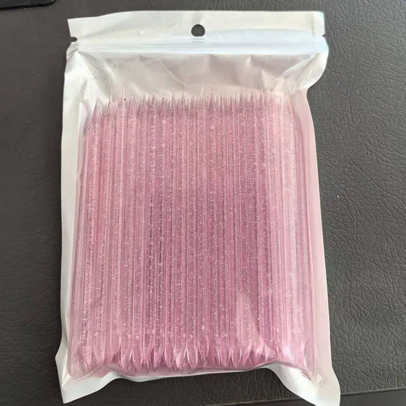 Nail glue sticks 100pcs in assorted colours including pink, blue, green, and purple, 7.5cm and 9.3cm lengths