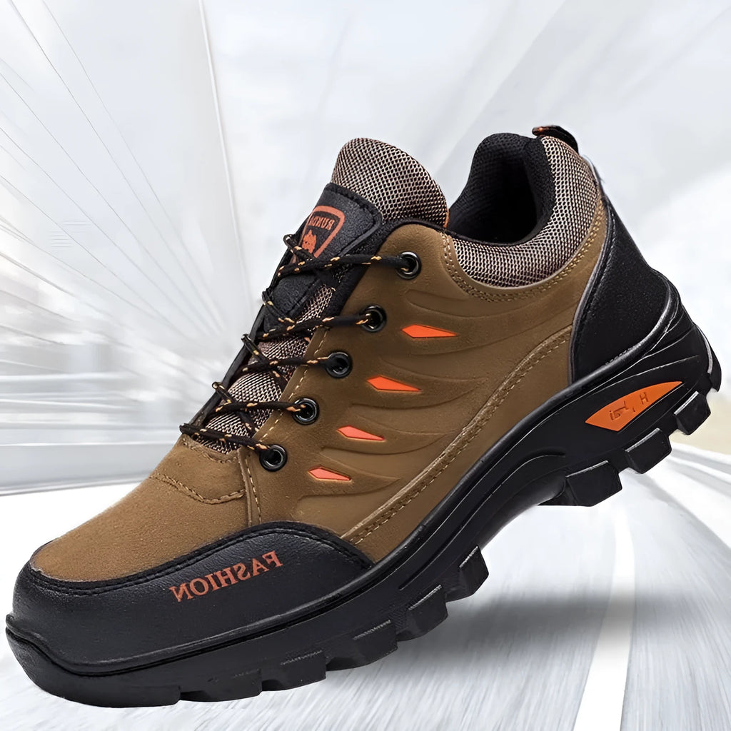 Men's brown suede hiking shoes with rubber sole and lace-up closure, showing round toe and mid-top design