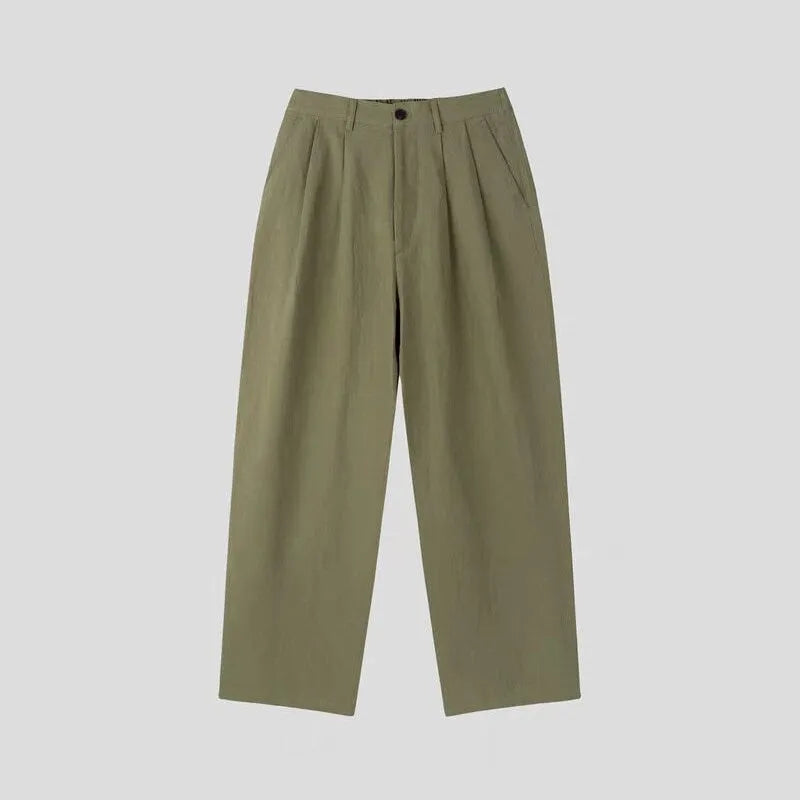 Men's apricot coloured wide-leg cotton linen suit trousers with a loose fit and pencil pants leg opening.