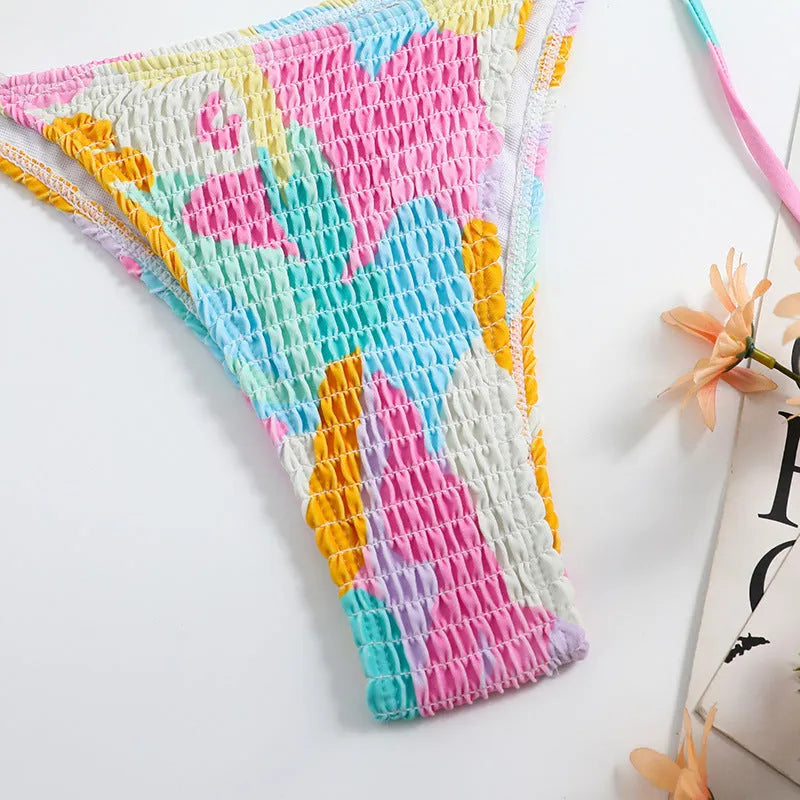 Women's triangle bikini swimsuit with floral gradient pattern and smocking craft detailing