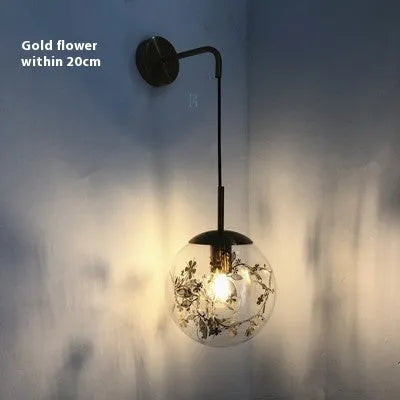 Modern glass wall-mounted LED bedside lamp in silver or gold finish