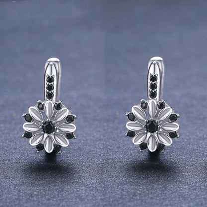 Copper inlaid zircon flower ear clips for women, black floral design