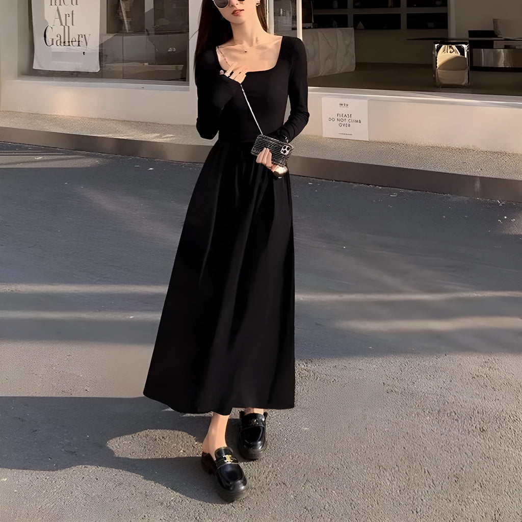 Black knitted square collar dress with long sleeves and an A-line skirt on a mannequin.