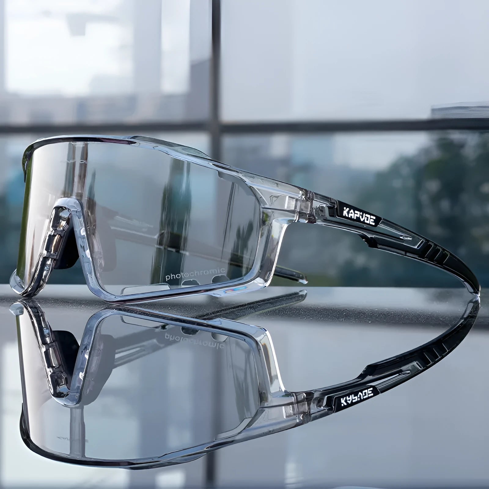 Photochromic cycling sports goggles with semi-rimless TR90 frame on a solid colour background.