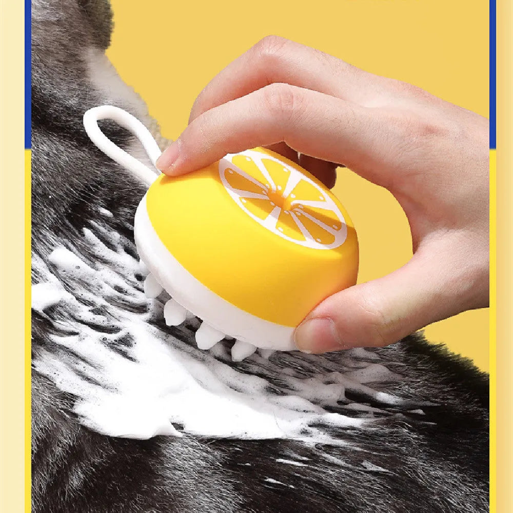 Yellow silicone pet bath brush and massage comb with 3D massage head on a blue background.