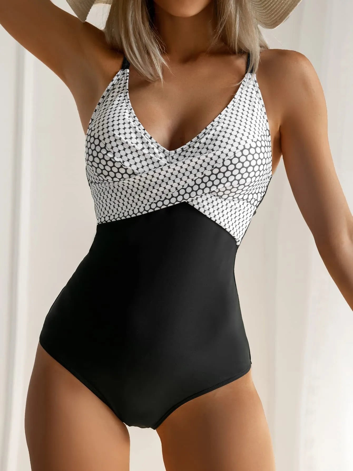 Women's printed bikini swimsuit with lace-up back and split skirt in a leopard print pattern.
