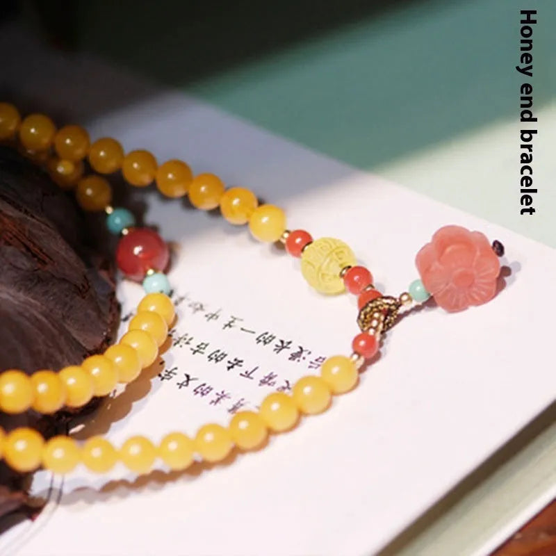 Yellow chicken grease beeswax amber bracelet with animal zodiac design and 5mm round retro styling