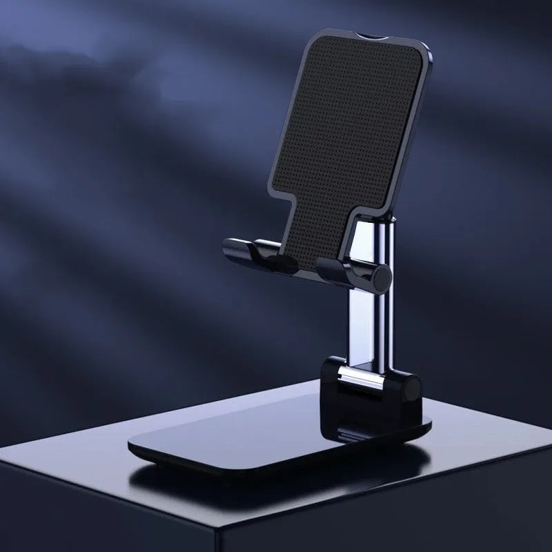 Universal folding telescopic mobile phone bracket stand in blue on a desktop, showing anti-skid silicone pad.