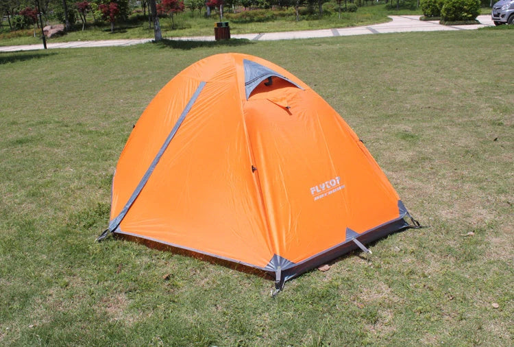 Double layer rainproof camping tent in green, orange, and blue for outdoor adventures