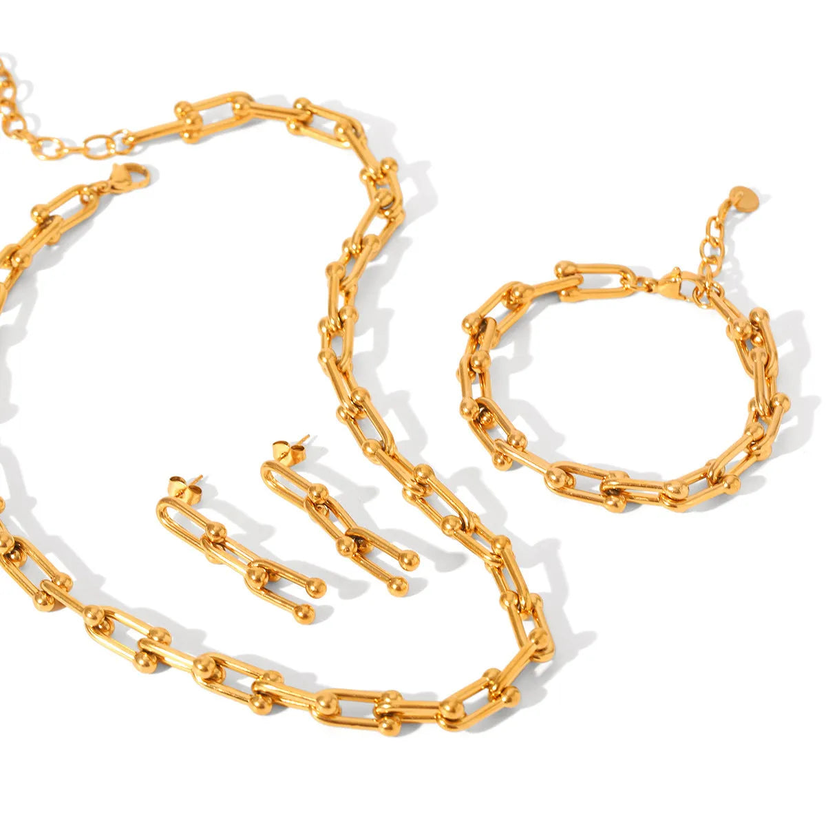 Stainless steel horseshoe chain jewellery set with titanium steel pendant showing necklace, bracelet and earring pieces