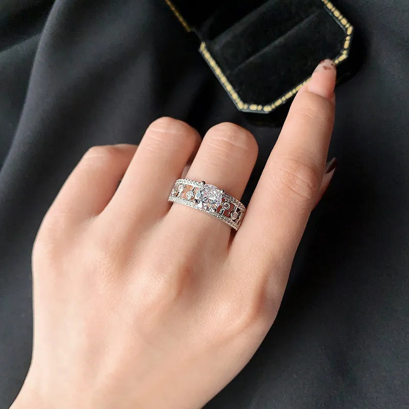 Women's copper hexagon hollow-out anti-moissanite ring in ins style on a plain background