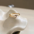 Women's golden electroplated stainless steel ring showing both love heart and oval shape variations