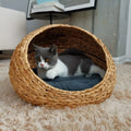 Hand-woven gourd grass cat nest in apricot colour with plastic frame, top view