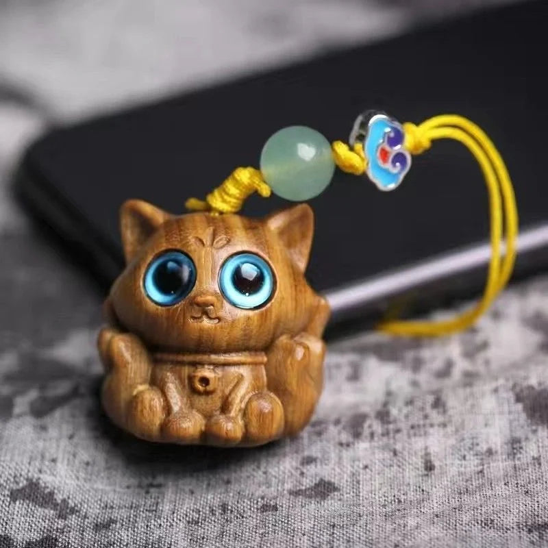 Handcrafted sandalwood kitten ornaments in various styles and colours