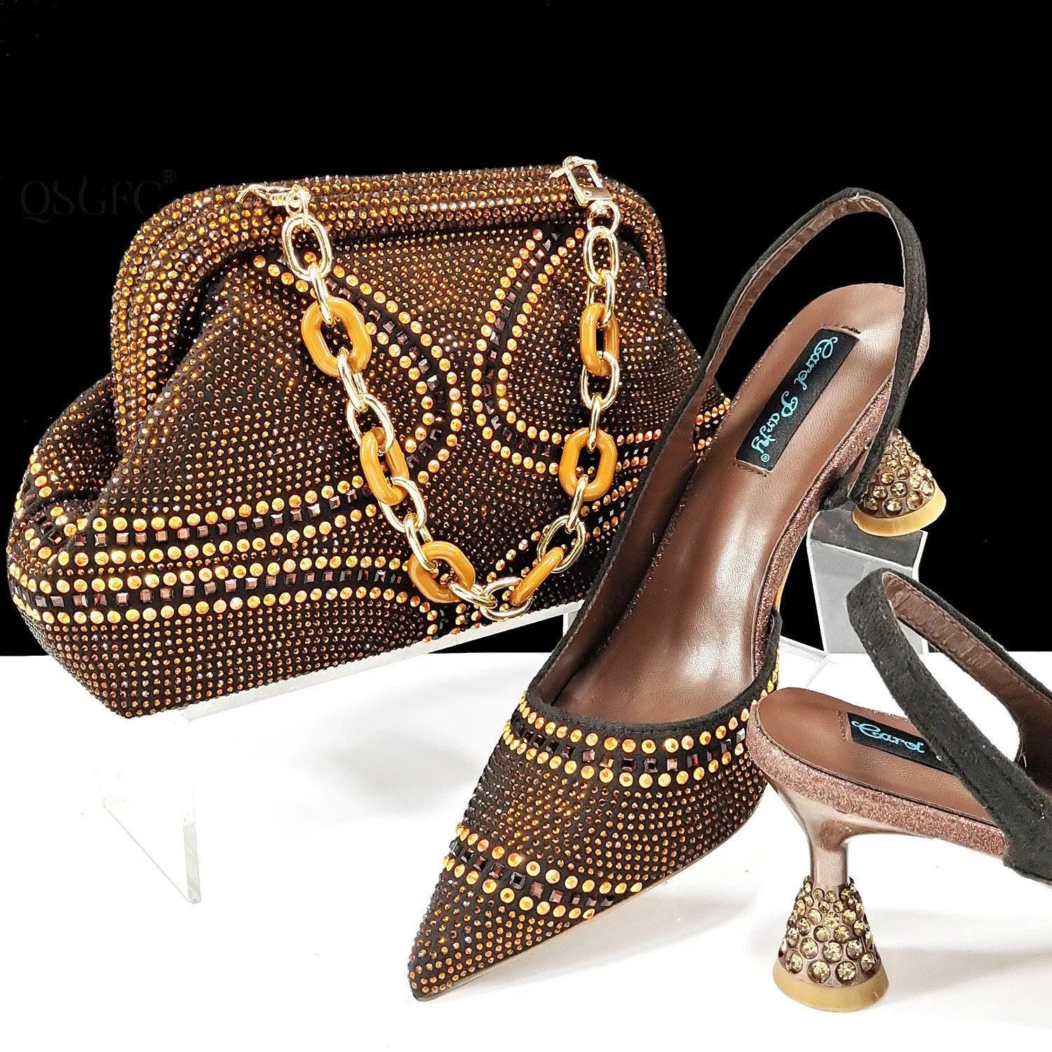 Women's pointed toe high heel shoe and small clutch bag set with rhinestone detail on a wine glass heel.