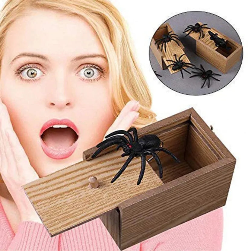 Wooden prank scare box closed on table, with random jumping animal surprise inside for April Fools' tricks.