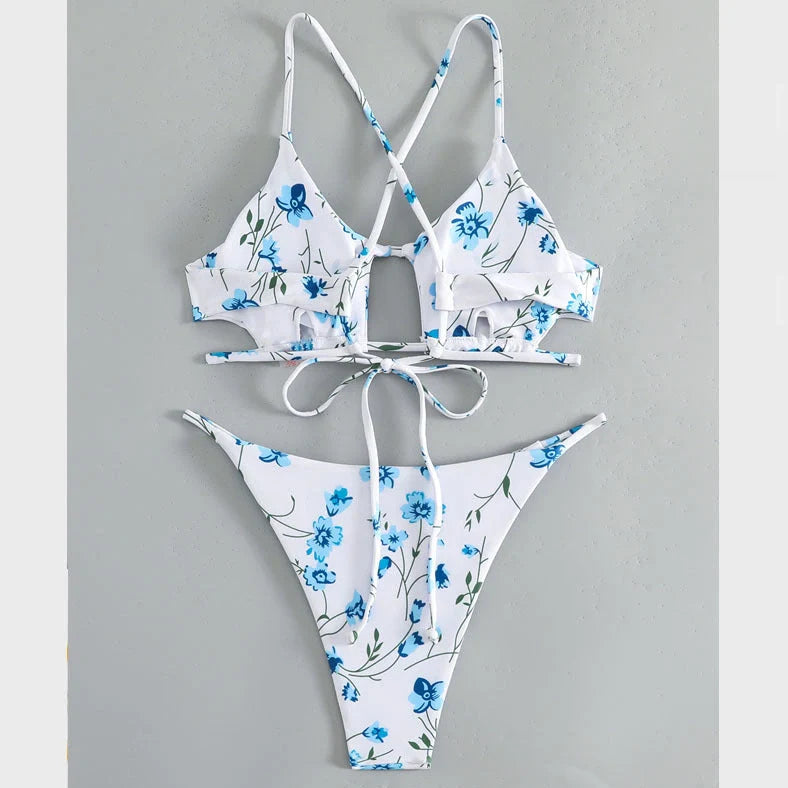 Women's floral pattern tie-neck triangle swimsuit with matching shorts on mannequin