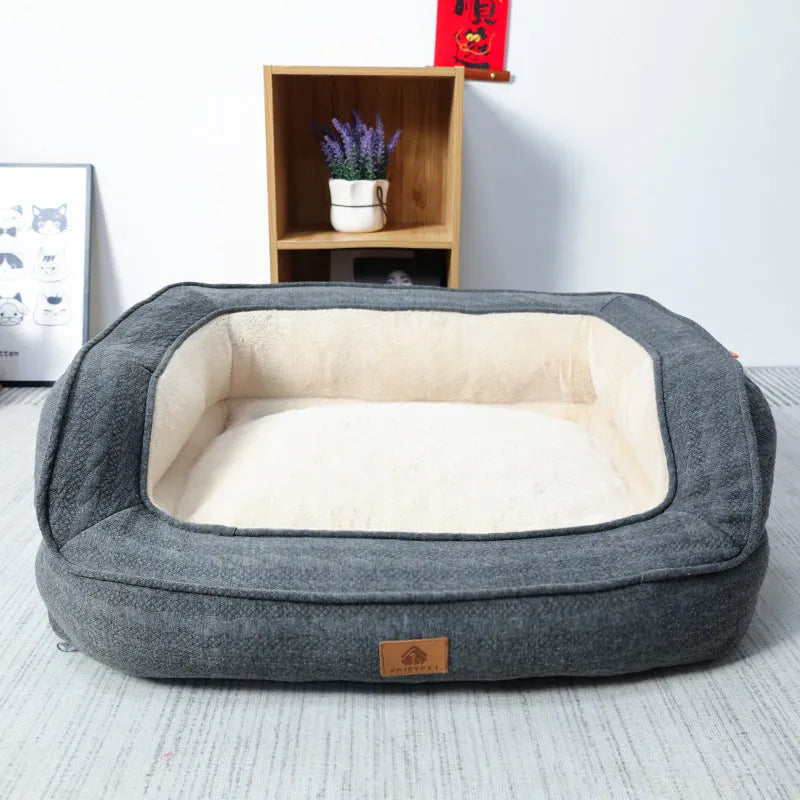 Rust red sofa-style dog bed with removable washable cloth cover, size XL, on a light floor