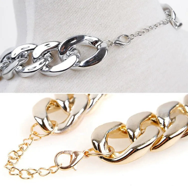Gold chain dog collar with geometric plastic and resin ornaments on small dog neck