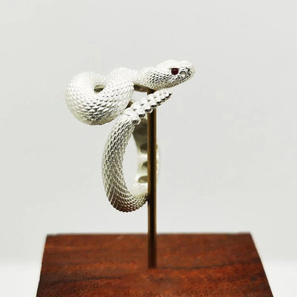 Adjustable copper snake ring in black and white with gold tail options